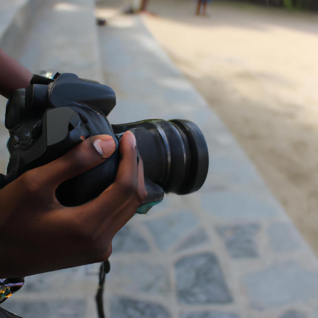 Person holding camera, capturing moments