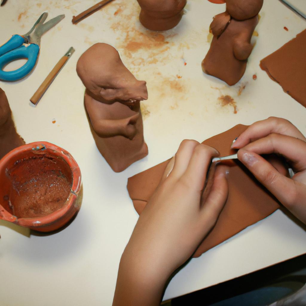 Person sculpting clay with tools