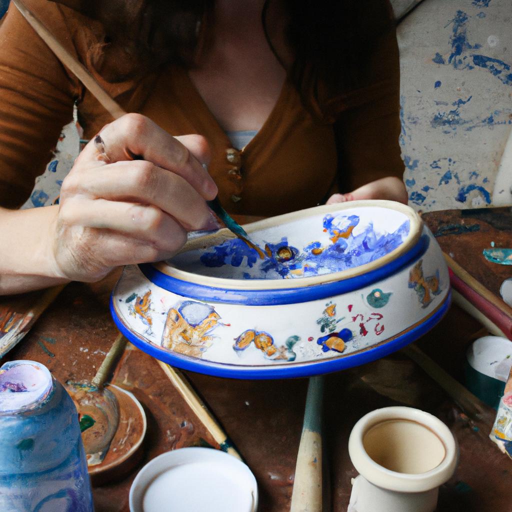 Artist painting intricate ceramic designs